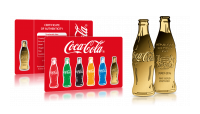 Złota moneta w kształcie butelki Coca-Coli.