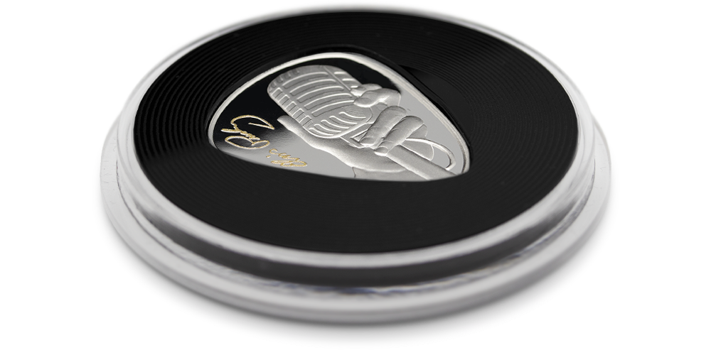 Elvis Presley - oficjalna srebrna moneta w kształcie kostki gitarowej w ochronnej kapsule.