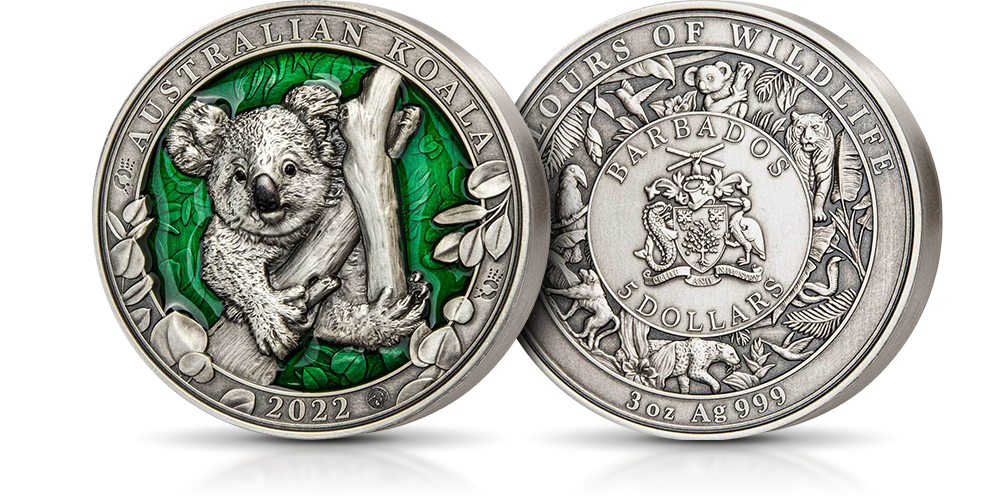 Koala na srebrnej monecie z zieloną emalią.