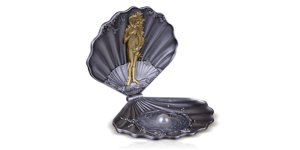 Moneta platerowana czystym złotem i ozdobiona perłą. Moneta platerowana czystym złotem i ozdobiona perłą.